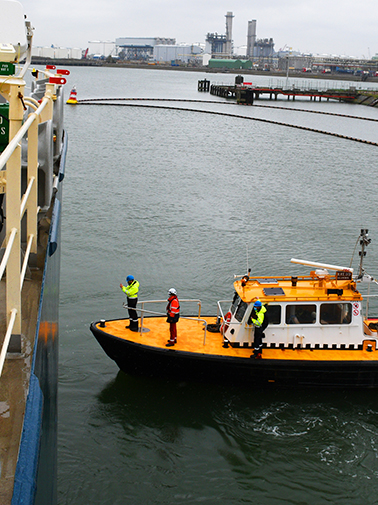 Ship floating on the river with employees on it